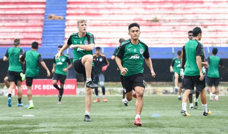 John Johnson and Sunil Chhetri go through warm-up routines on the eve of Bengaluru FC's ISL opener against Mumbai City FC at the Bangalore Football Stadium, in Bengaluru, on Saturday. bfc, sunil chhetri