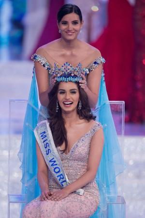 Miss World 2016 Stephanie Del Valle (top) put the crown on Miss India Manushi Chhilar (down) after she wins the 67th Miss World contest final in Sanya. Miss World 2017 winner
