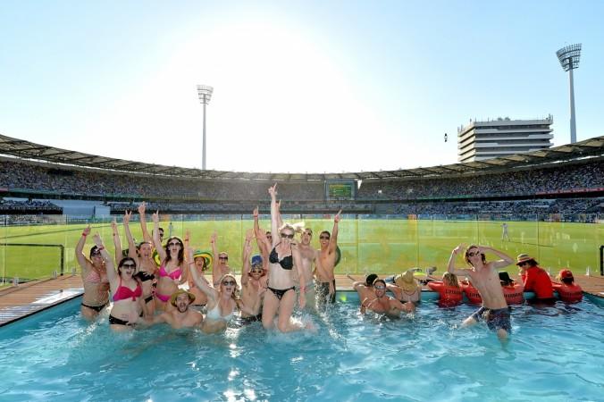 Fans enjoy themselves as they cool down in the pool during day one of the First Test match between Australia and Pakistan at The Gabba on December 15, 2016 in Brisbane, Australia ashes, gabba