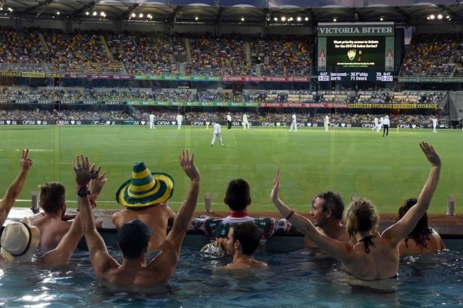 Spectators cheer inside a pool during the first day-night cricket Test between Australia and Pakistan at the Gabba in Brisbane on December 15, 2016 ashes, gabba