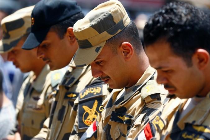 Egyptian army officers react during the funeral of officer Khaled al-Maghrabi, who was killed during a suicide bomb attack on an army checkpoint in Sinai, in his hometown Toukh, Al Qalyubia Governorate, north of Cairo, Egypt 8 July, 2017. Egyptian army officers react during the funeral of officer Khaled al-Maghrabi, who was killed during a suicide bomb attack