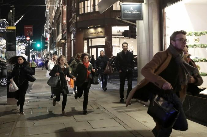 People run down Oxford Street, London, Britain November 24, 2017 Oxford Street