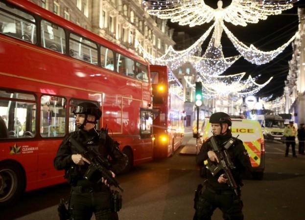 Armed police officers stand on Oxford Street, London, Britain November 24, 2017. Oxford Street