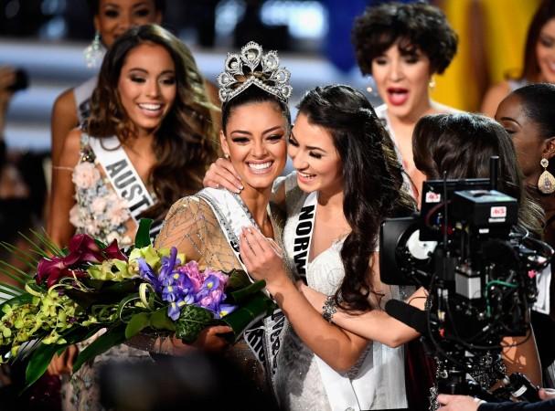 Miss South Africa 2017 Demi-Leigh Nel-Peters (center L) embraces Miss Teen USA 2017 Sophia Dominguez-Heithoff (center R) as she is named the 2017 Miss Universe during the 2017 Miss Universe Pageant at The Axis at Planet Hollywood Resort & Casino on November 26, 2017 in Las Vegas, Nevada. Miss Universe 2017