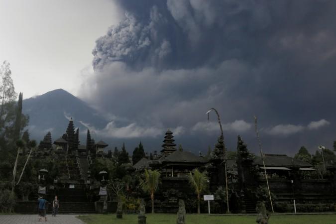 Foreign tourists take pictures as Mount Agung erupts at Besakih Temple in Karangasem, Bali, Indonesia on November 26, 2017 Bali volcano