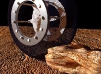 Spring Tire made of nickel titanium, a shape memory alloy, undergoing durability test at NASA's Jet Propulsion Laboratory (JPL).