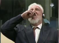 Shocking moment Bosnian Croat war criminal drinks poison during court hearing