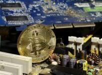 A copy of bitcoin standing on PC motherboard is seen in this illustration picture, October 26, 2017.
