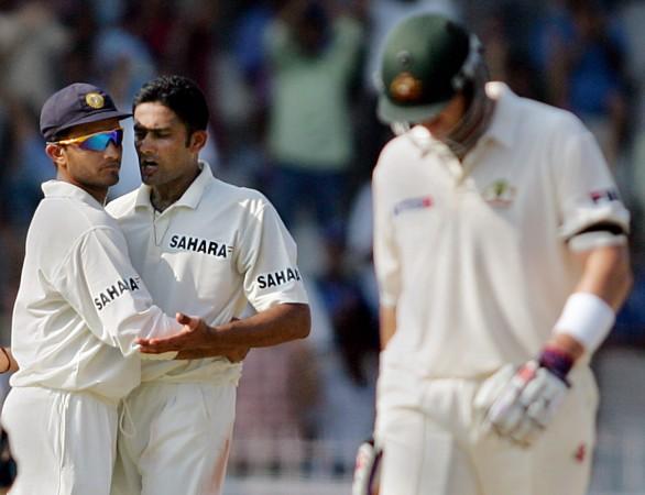 India's Anil Kumble (2nd-L) celebrates with team captain Saurav Ganguly (L) after dismissing Australia's Matthew Hayden (R) during the third day's play of the second Test in Madras October 16, 2004. Anil Kumble Sourav Ganguly