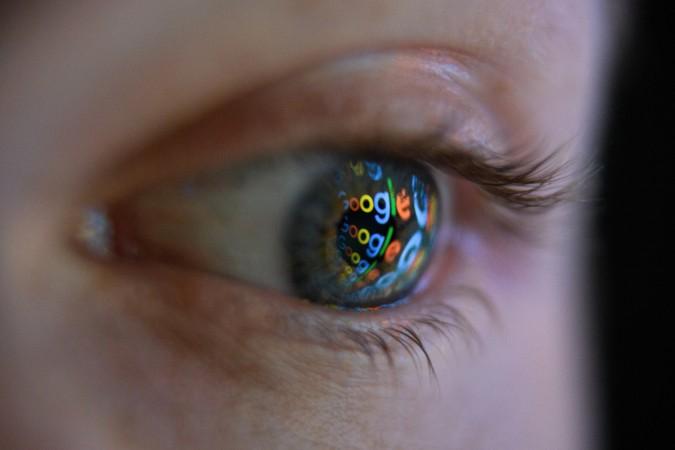 LONDON, ENGLAND - AUGUST 09: In this photo illustration, an image of the Google logo is reflected on the eye of a young man on August 09, 2017 in London, England. Founded in 1995 by Sergey Brin and Larry Page, Google now makes hundreds of products used by billions of people across the globe, from YouTube and Android to Smartbox and Google Search. Cyber Security Concerns In The Global Wake of Hacking Threat