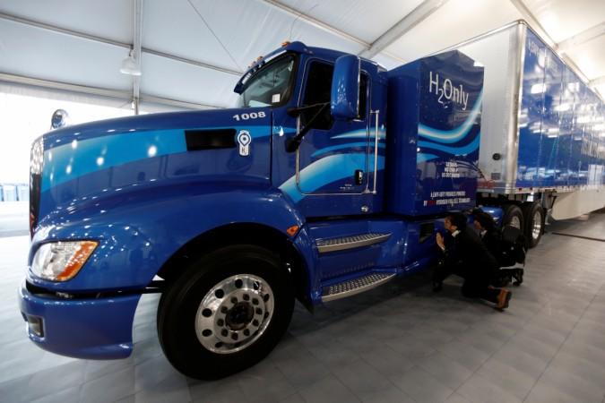 Attendees look over a prototype hydrogen powered fuel cell semi-truck shown by Toyota at the Los Angeles Auto Show in Los Angeles, California, U.S., November 30, 2017. Attendees look over a prototype hydrogen powered fuel cell semi-truck shown by Toyota at the Los Angeles Auto Show 2017