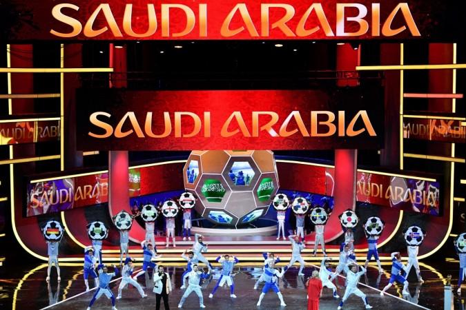Artists perform on stage as 'Saudi Arabia' is displayed on screens during the Final Draw for the 2018 FIFA World Cup football tournament at the State Kremlin Palace in Moscow on December 1, 2017 fifa world cup