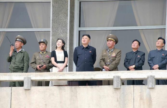 Kim Jong-un and his wife Ri Sol-ju look on during a visit to Unit 1017 of the Korean People's Army (KPA) Air and Anti-Air Force Ri Sol-ju