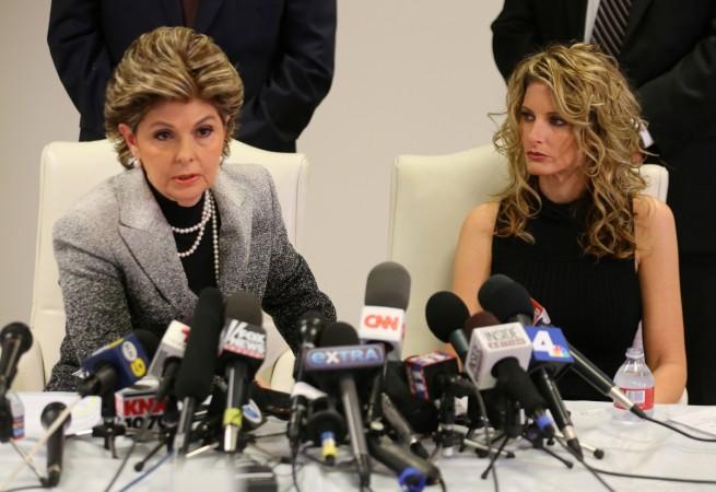Summer Zervos listens as her attorney Gloria Allred speaks during a news conference announcing the filing of a lawsuit against Donald Trump. Summer Zervos