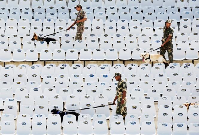 Indian security personnel with sniffer dogs prior to the start the 2011 ICC World Cup second Semi-Final at Punjab Cricket Association (PCA) Stadium on March 30, 2011, in Mohali PCA Stadium dogs
