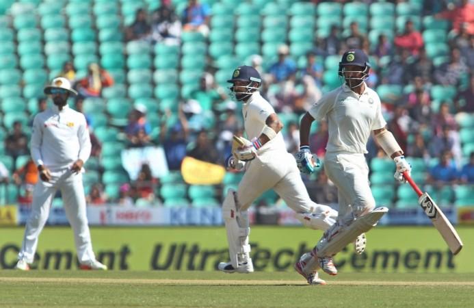 Kohli and Cheteshwar Pujara run between the wickets during India-Sri Lanka second Test in Nagpur recently. Virat Kohli Cheteshwar Pujara