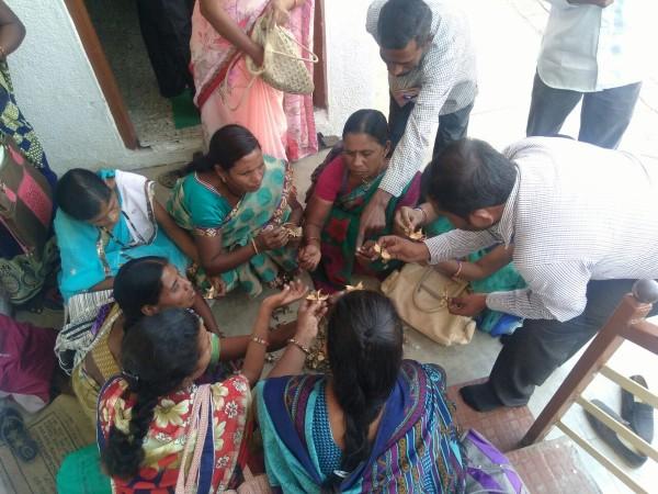 An official Laxman Khandawe with cotton farmers in Amravati (Vidarbha) Maharashtra guiding them in control measures of pink bollworm. Vidarbha farmers