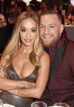 Rita Ora (L) and Conor McGregor attend a drinks reception ahead of The Fashion Awards 2017 in partnership with Swarovski at Royal Albert Hall on December 4, 2017 in London, England conor mcgregor, ufc, rita ora