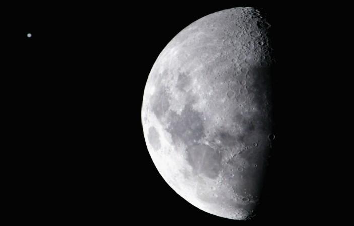 The planet Jupiter (L) appears as a faint disc next to the moon June 16, 2005 in Sydney, Australia. The phenomenon, which occurs every few years, is caused when the moon moves between Jupiter and the earth and allows people to see the planet with the naked eye. jupiter