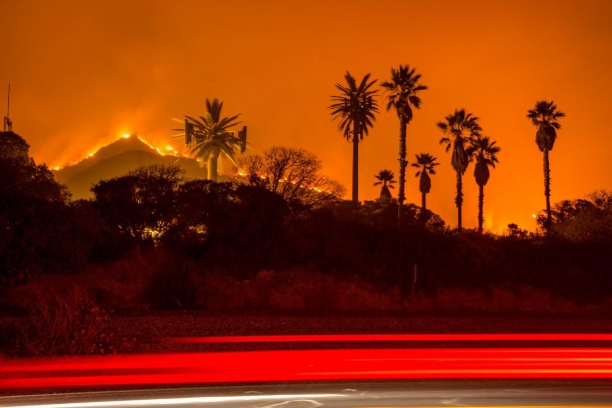 The Thomas Fire burns along a hillside near Santa Paula, California, on December 5, 2017 Thomas Fire