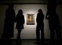 Members of Christie's staff pose for pictures next to Leonardo da Vinci's
