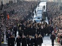 Thousands gather in Paris for French rock legends funeral