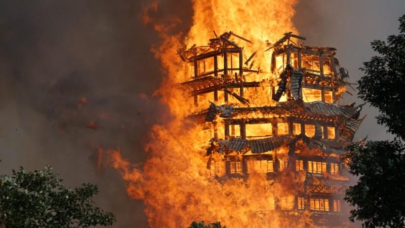 Fire engulfs a 16-story wooden tower at Jiulong Town on December 10, 2017 in Deyang, Sichuan Province of China. A huge blaze has engulfed and destroyed a 16-story wooden tower, known as the tallest of its kind in Asia, after a fire, starting at the Lingguan Mansion, raged through a monastery in Sichuan Province, southwest China. Asia's tallest wooden tower