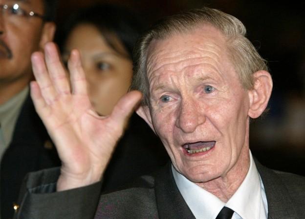 Former U.S. soldier Charles Robert Jenkins waves upon arriving at a Jakarta hotel from North Korea in this July 9, 2004 file photo. Charles Robert Jenkins