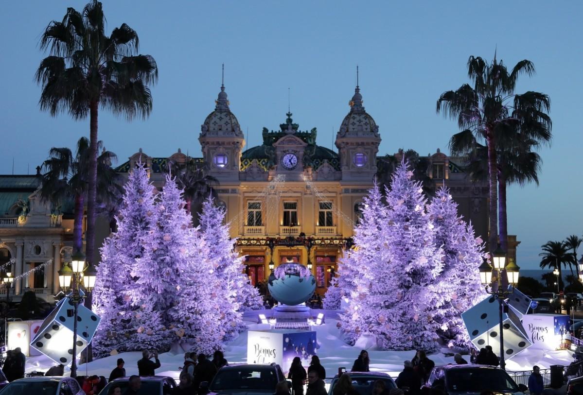 Christmas trees frame the Monte Carlo Casino as part of holiday season decorations in Monaco, December 9, 2017 Christmas