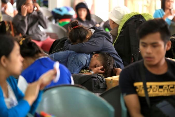 Stranded passengers sit stranded at the port in Matnog, Sorsogon on December 17, 2017 Philippines