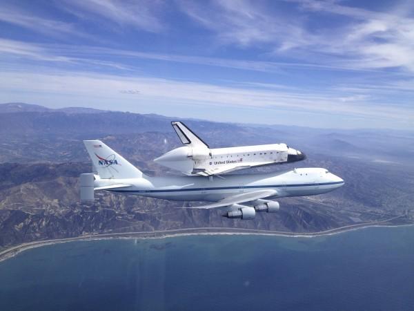 Space shuttle Endeavour, mounted atop a NASA 747 Shuttle Carrier Aircraft, soars over the Californian coast near Ventura, on its way to Los Angeles during the final portion of its tour of California, in this September 21, 2012 NASA handdout photo. Endeavour will be moved to its permanent home at the California Science Center mid-October. Space shuttle Endeavour, mounted atop a NASA 747