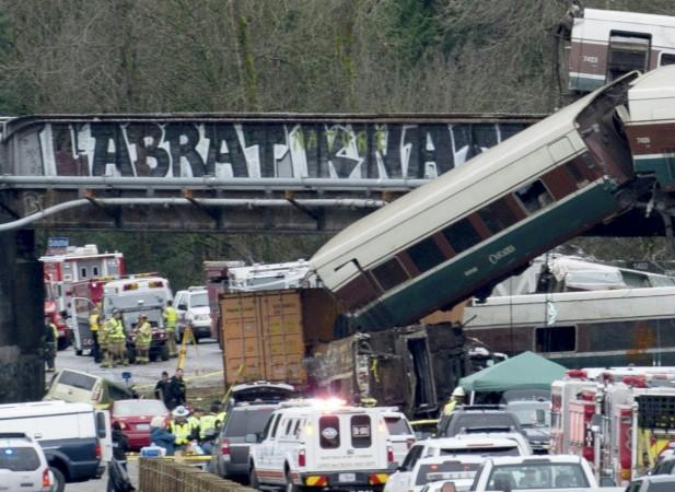 The scene of a portion of the Interstate I-5 highway after an Amtrak high speed train derailled from an overpass early December 18, 2017 Amtrak train derails