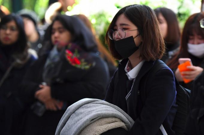 Tearful fans gather to visit the mourning altar for Kim Jong-Hyun, a 27-year-old lead singer of the massively popular K-pop boyband SHINee, at a hospital in Seoul on December 19, 2017. Kim Jonghyun