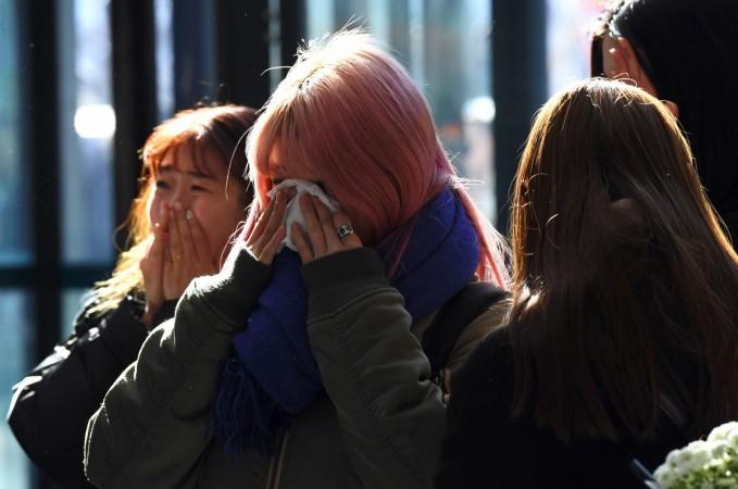 Tearful fans gather to visit the mourning altar for Kim Jong-Hyun, a 27-year-old lead singer of the massively popular K-pop boyband SHINee, at a hospital in Seoul on December 19, 2017. Kim Jonghyun