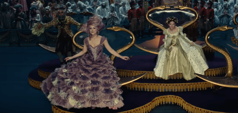The entire costume is elaborate to say the least, with a structured frock and ribbon shoulder and a classic fitted bodice that she dances and prances and billows around, flaunting a layered petticoat skirt. keira 2