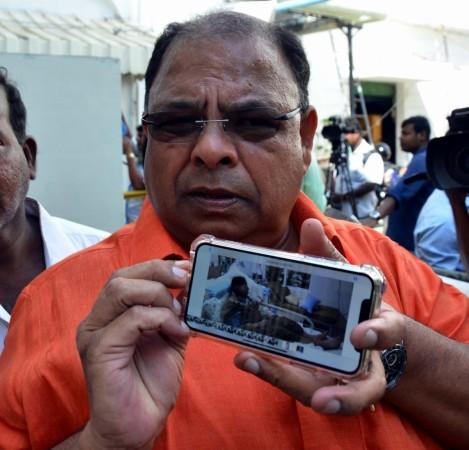 In picture: Disqualified MLA P Vetrivel shows a video clip of the late J Jayalalithaa purportedly on her hospital bed, in Chennai on December 20, 2017. A day ahead of a critical by-election in Chennai, sidelined AIADMK leader TTV Dinakaran's faction on Wednesday triggered a major row by releasing the video clip. RK Nagar byelection