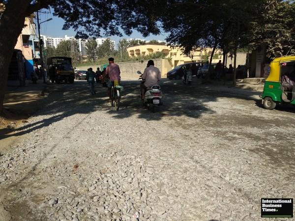 Busy Kaggadasapura road filled with construction metals Kaggadasapura road, Bangalore Potholes