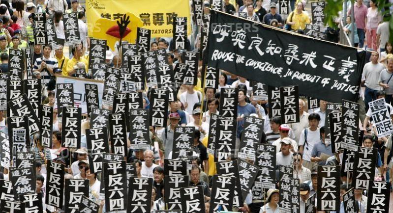 Thousands of pro-democracy protesters in Hong Kong participate in a march to mark the upcoming 15th anniversary of Beijing's military crackdown on the pro-democracy movement at Tiananmen Square, May 30, 2004. Tiananmen Square