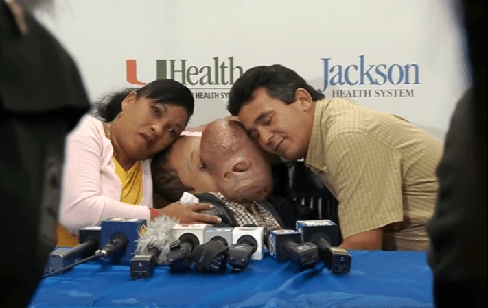 Emanuel Zayas, 14 with his parents. emanuel zayas
