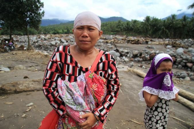 In picture: Residents weep in a village devastated by flash floods in Salvador, Lanao del Norte in southern Philippines, December 24, 2017. Philippines typhoon