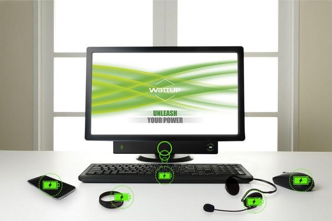 The WattUp Mid Field wireless charging device (attached below the monitor) powers up multiple devices within a 3 feet radius WattUp wireless charging system
