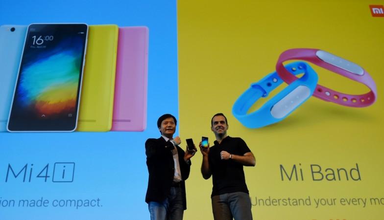 Founder, Chairman and CEO of Xiaomi Global, Lei Jin (L) and Vice President, Hugo Barra gesture during the launch of Xiaomi's Mi4i smart phone and Mi Band in New Delhi on April 23, 2015. INDIA-ECONOMY-SMARTPHONE