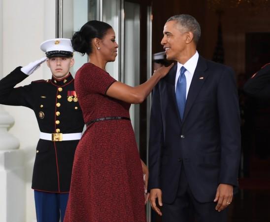 Barack Obama and First Lady Michelle Obama prepare to greet President-elect Donald Trump and his wife Melania to the White House in Washington, DC January 20, 2017. barack and michelle
