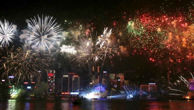 Fireworks explode over Victoria Harbour in Hong Kong on January 1, 2015. Just like previous years, the city's iconic skyline along Victoria Harbour will light up with an eight-minute pyrotechnic display, as tens of thousdands of partygoers will flock to the waterfront to celebrate. hong kong fireworks