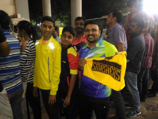 Chennai Smashers' fan Srinivasalu (holding team flag) cheering for the team on Saturday Chennai Smashers fan