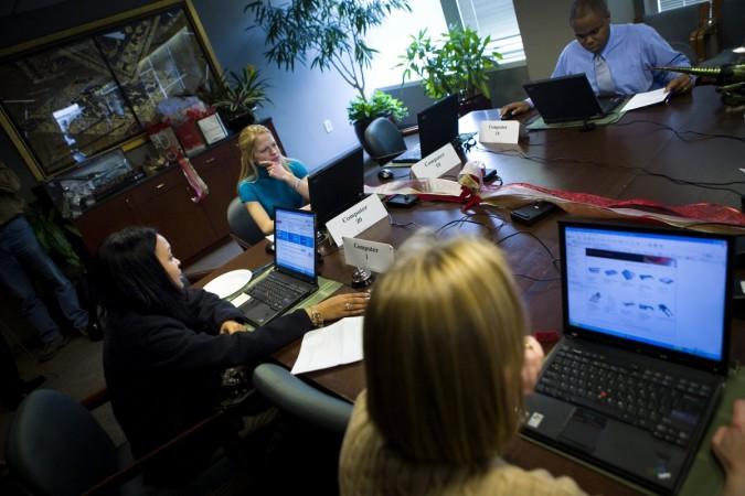 REPRESENTATIONAL IMAGE: Consumers shop online during a shop and lunch event in the boardroom of the National Retail Federation November 27, 2006 in Washington, DC. Workplace