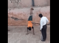 warden caught beating two school children