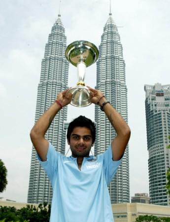 Virat Kohli with the ICC U-19 Cricket World Cup at the Kuala Lumpur Twin Towers in 2008 kohli