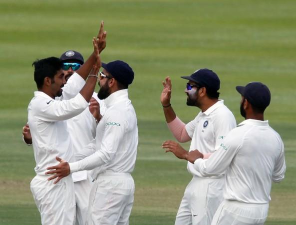 Indian players celebrate a wicket during the 1st Test against South Africa in Cape Town. Jasprit Bumrah