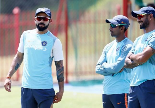 Virat Kohli, Wriddhiman Saha and Shikhar Dhawan
